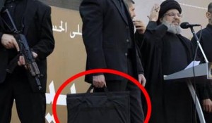 ماذا بداخل الشنطة التي يحملها مرافق حسن نصرالله؟