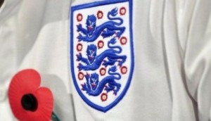 تيريزا ماي تنتقد حظر الفيفا ارتداء لاعبي بريطانيا شارات زهرة الخشخاش